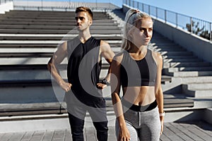 Young sportive couple, in sportswear, doing sports exercises outdoors, sport, healthy lifestyle
