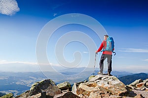 Young sportive hiker trekking in the mountains. Sport and active life