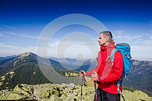 Young sportive hiker trekking in the mountains. Sport and active life