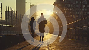 young sports couple are running in the city on the morning, morning run scene, sports lifestile