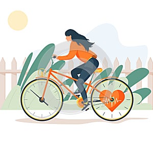 A young sports girl rides a bicycle in nature. Healthy lifestyle.