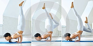 Young sports woman in white sportswear practicing yoga, doing handstand and balance Formidable Face Yoga Pose in a gym