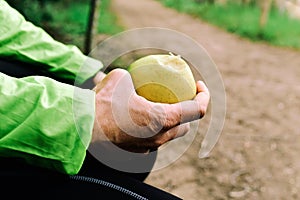 Young sportsman eating an apple