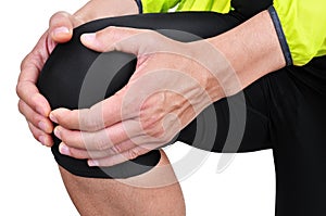 Young sportsman with knee pain photo