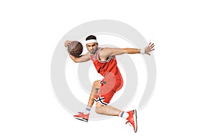 young sportsman playing with basketball ball