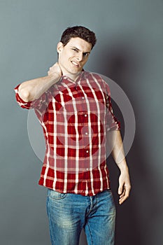 Young sportsman relaxing his neck,relaxing tension