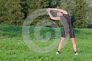 Young sportsman stretching