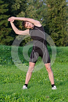 Young sportsman stretching