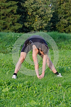 Young sportsman stretching