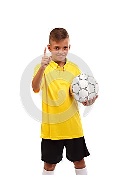 A young sportsman took the first place in a football competition isolated on a white background.