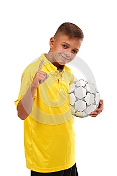 A young sportsman took the first place in a football competition isolated on a white background.