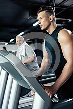 young sportsman training on treadmill