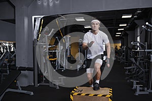 Young sportsman working out at the gym