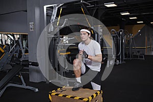 Young sportsman working out at the gym