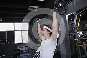 Young sportsman working out at the gym