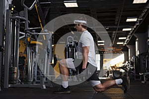 Young sportsman working out at the gym