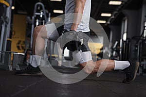 Young sportsman working out at the gym