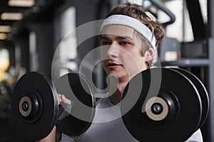 Young sportsman working out at the gym