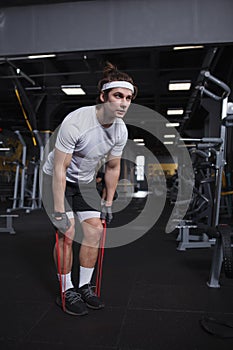 Young sportsman working out at the gym