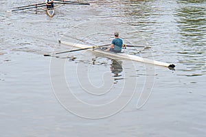 Young sportsmen in a boat, rowing on the river Rioni, Poti, Georgia