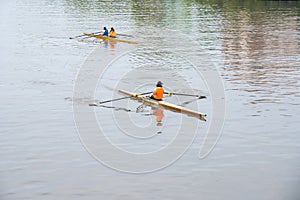 Young sportsmen in a boat, rowing on the river Rioni, Poti, Georgia