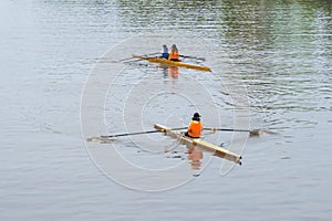 Young sportsmen in a boat, rowing on the river Rioni, Poti, Georgia