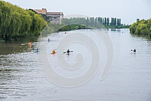 Young sportsmen in a boat, rowing on the river Rioni, Poti, Georgia