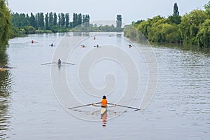 Young sportsmen in a boat, rowing on the river Rioni, Poti, Georgia