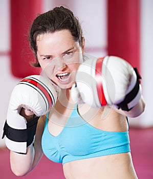 Young sportwoman practicing different kiks