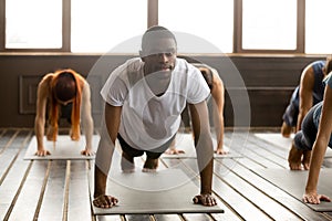 Young sporty black man in Plank pose