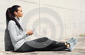 Young and sporty brunette woman training outdoor. Fitness, sport, lifestyle and health care.