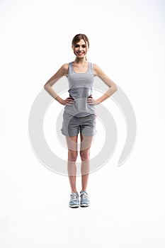 Young sporty Caucasian female model isolated on white background in full body