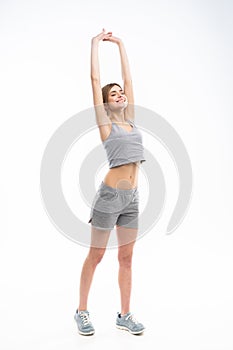 Young sporty Caucasian female model isolated on white background in full body