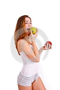 Young, sporty, fit and beautiful girl with apples isolated on white