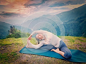 Young sporty fit woman doing Hatha Yoga asana