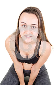 Young sporty muscular woman doing sport isolated over white background in clothing performing exercise