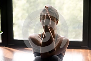 Young sporty woman doing arm stretch exercise