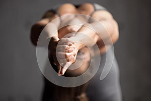 Young sporty woman doing Camel exercise, close up view