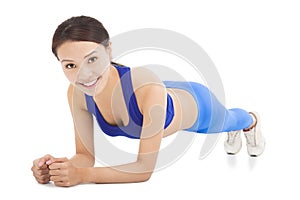 Young sporty woman doing core exercise