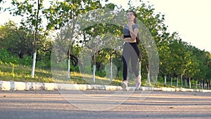 Young sporty woman are exercising with outdoor running in the city park.