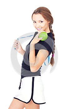 Young sporty woman with green apple