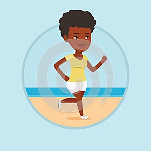 Young sporty woman jogging on the beach.