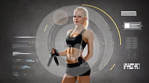 Young sporty woman with jumping rope