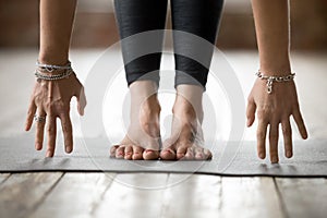 Young woman in Uttanasana pose photo