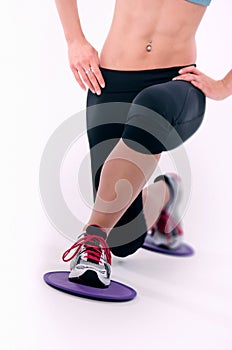 Young sporty woman using glide disks photo