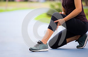 Young sporty women are tied with running shoes to run exercise in the morning..Portrait of beautiful Women exercising in the park