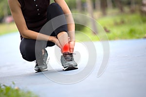 Young sporty women are tied with running shoes to run exercise in the morning..Portrait of beautiful Women exercising in the park