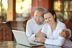 Young spouse with laptop