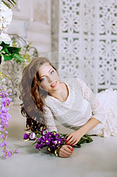 Young spring fashion woman in spring lux vintage interior. Springtime. Trendy girl on a luxury spring background. Allergic to pol photo
