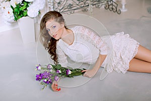 Young spring fashion woman in spring lux vintage interior. Springtime. Trendy girl on a luxury spring background. Allergic to pol